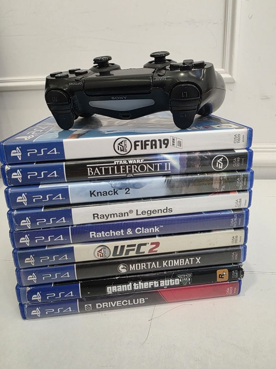 PlayStation 4 FAT + 8 игр (FIFA 19, BF2, Knack 2, Rayman, R&C, UFC 2, MKX, GTA V, DC) — 2